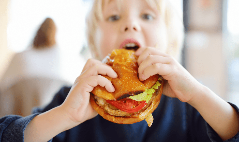 Kid eating a burger