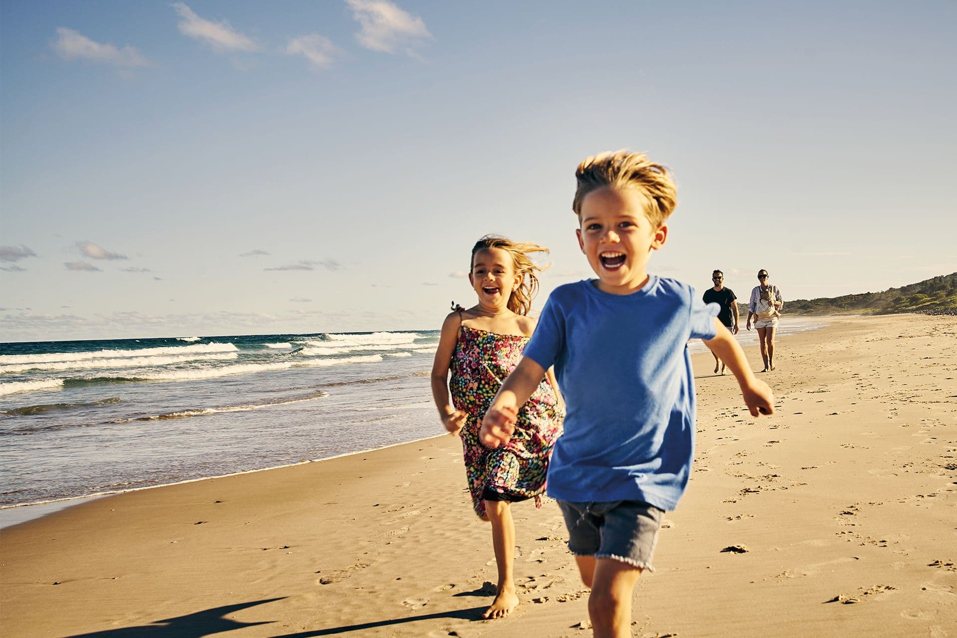 children run on the beach